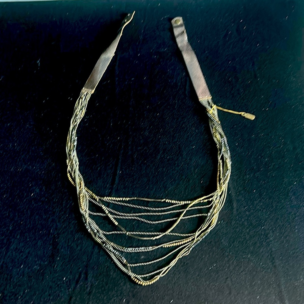 Dramatic multi strand mixed media necklace